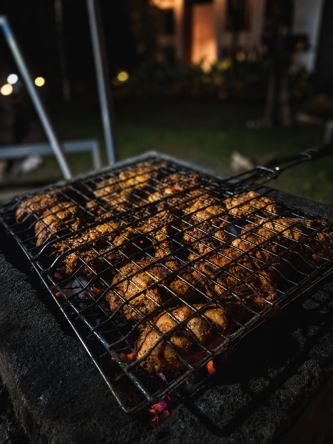 A barbeque grill sizzling on a mountain evening