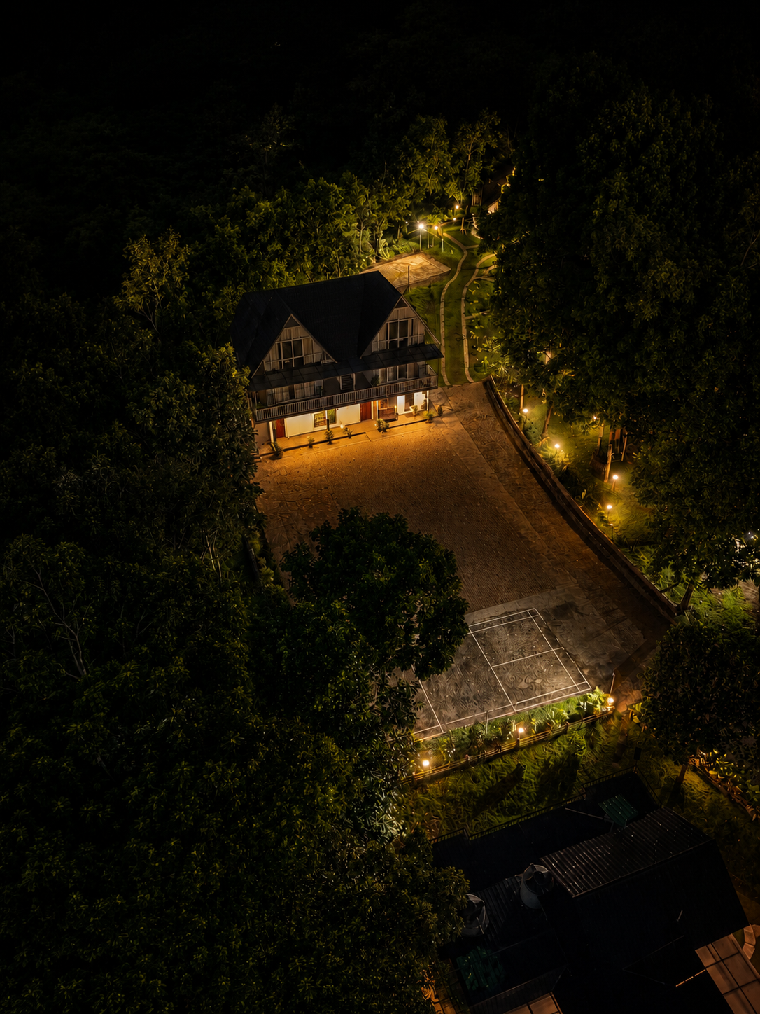 Aerial night view of View Point resort lit up among the Wayanad hills
